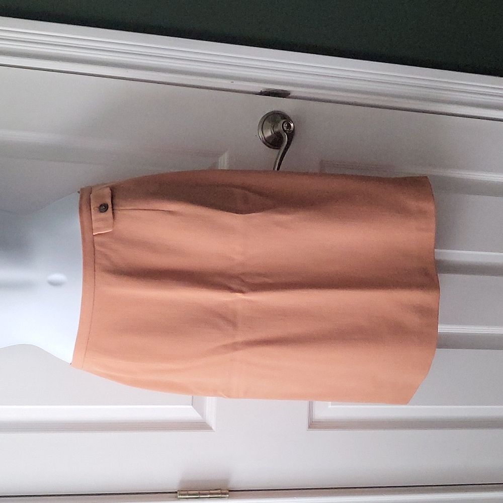 Authentic Burberry Skirt in sort of a peach color.